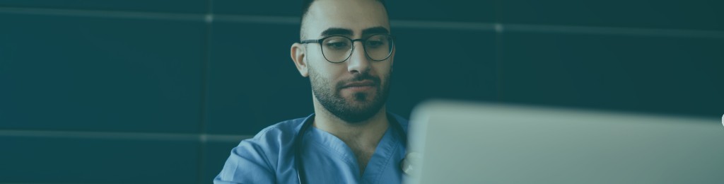 Healthcare professional reviewing clinical placement information on a laptop